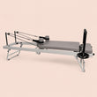 Reformer pilates pliable Lihyl — vue de profil, cadre acier blanc et sellerie grise