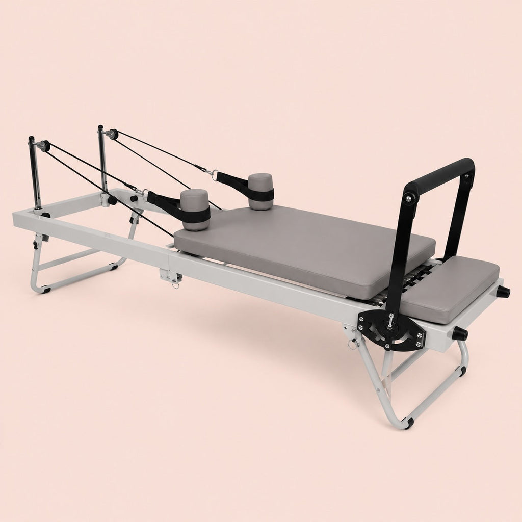 Reformer pilates pliable Lihyl — vue trois quarts avec barre d'appui